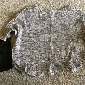 Wide neck sweater with leather lower sleeves